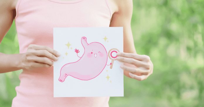woman holding picture of pink gut