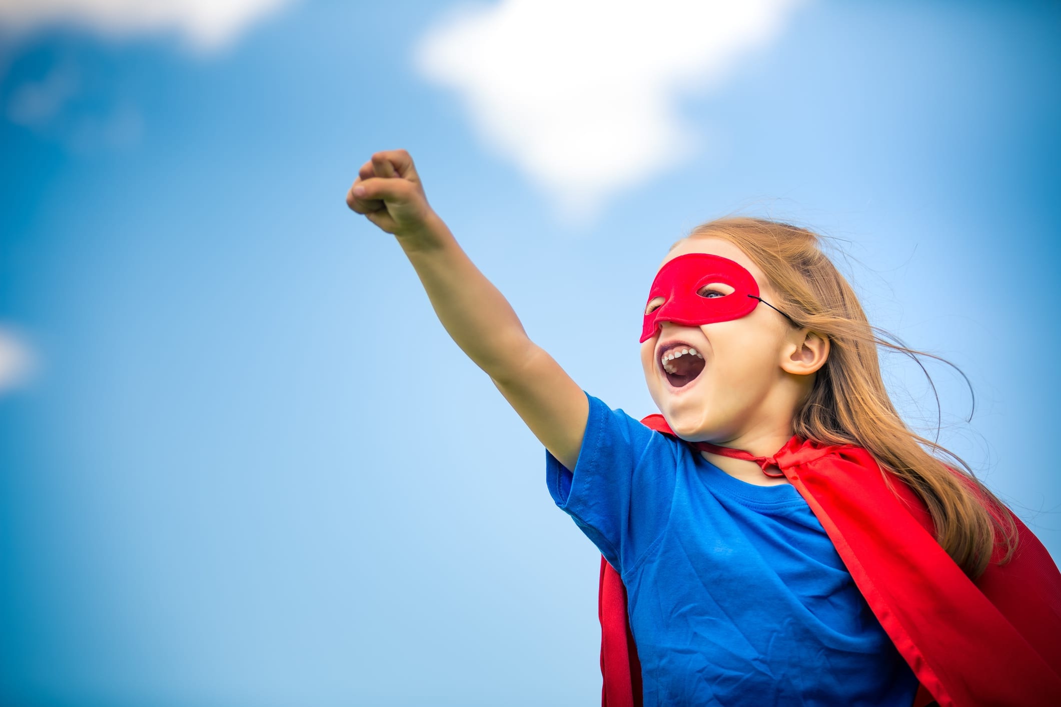 child wearing superhero costume