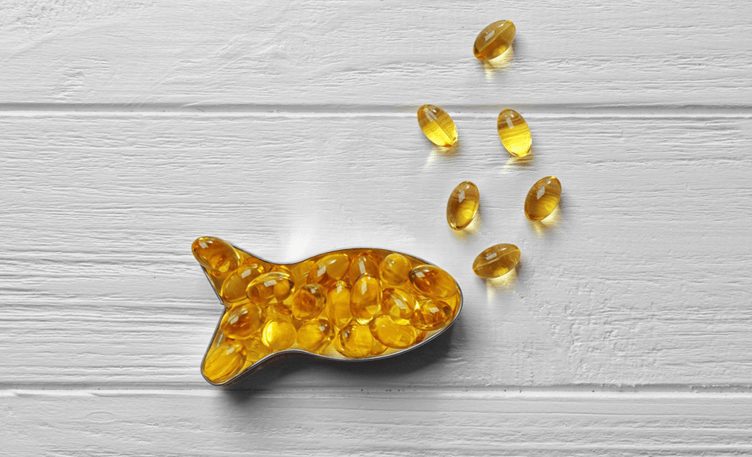 Fish oil capsules in shape of fish
