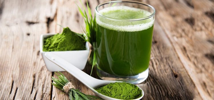 Green powdered drink mix and juice