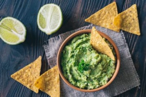 guacamole with chips in bowl