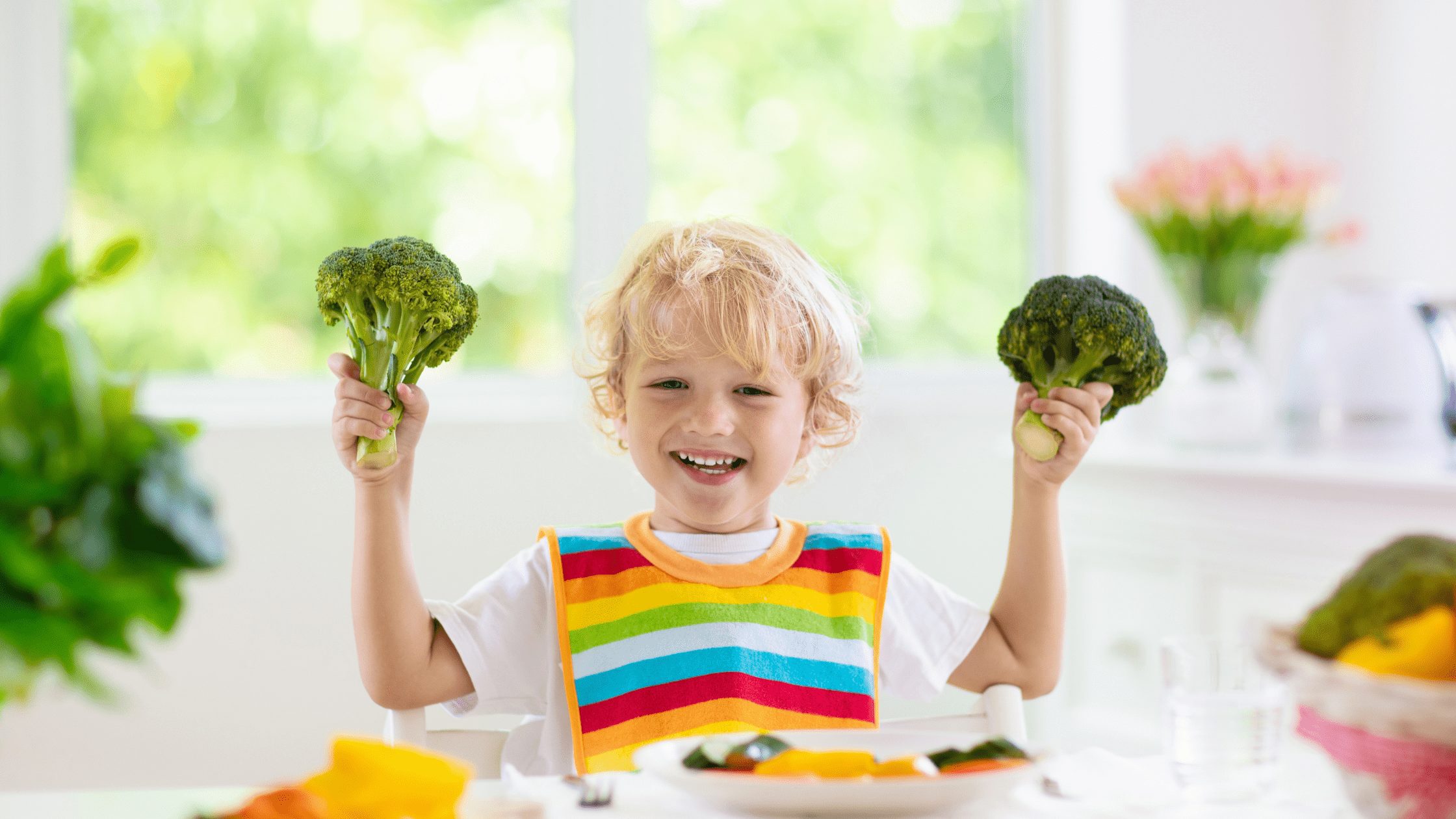 kid holding broccoli
